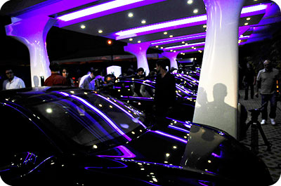 Tesla vehicles under a solar charging station canopy