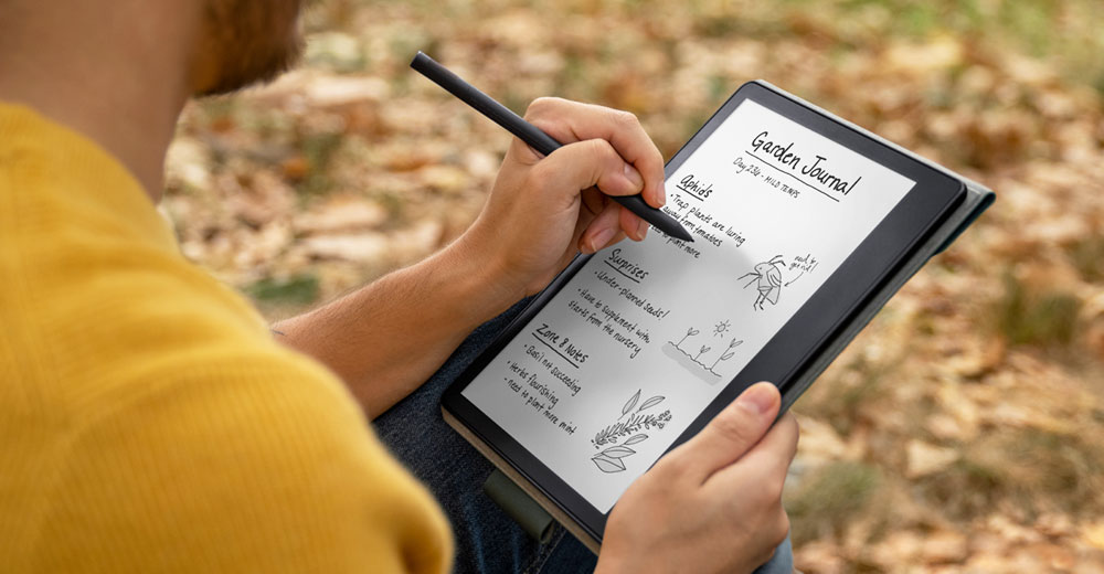 A person journaling on a Kindle Scribe