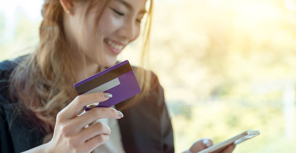 consumer making a credit card payment on a smartphone